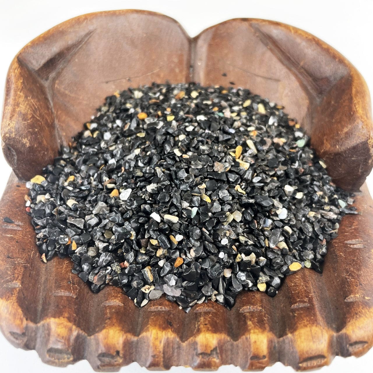 Black Onyx 1lb bag - Tiny Chips in a wood bowl up close