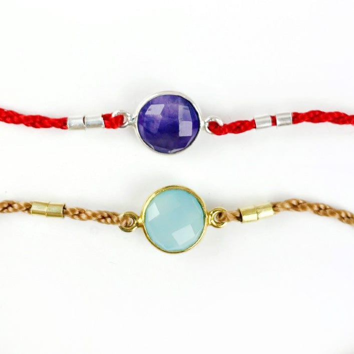 Up close of the amethyst and blue chalcedony bezal showing connectors and accents in gold and silver