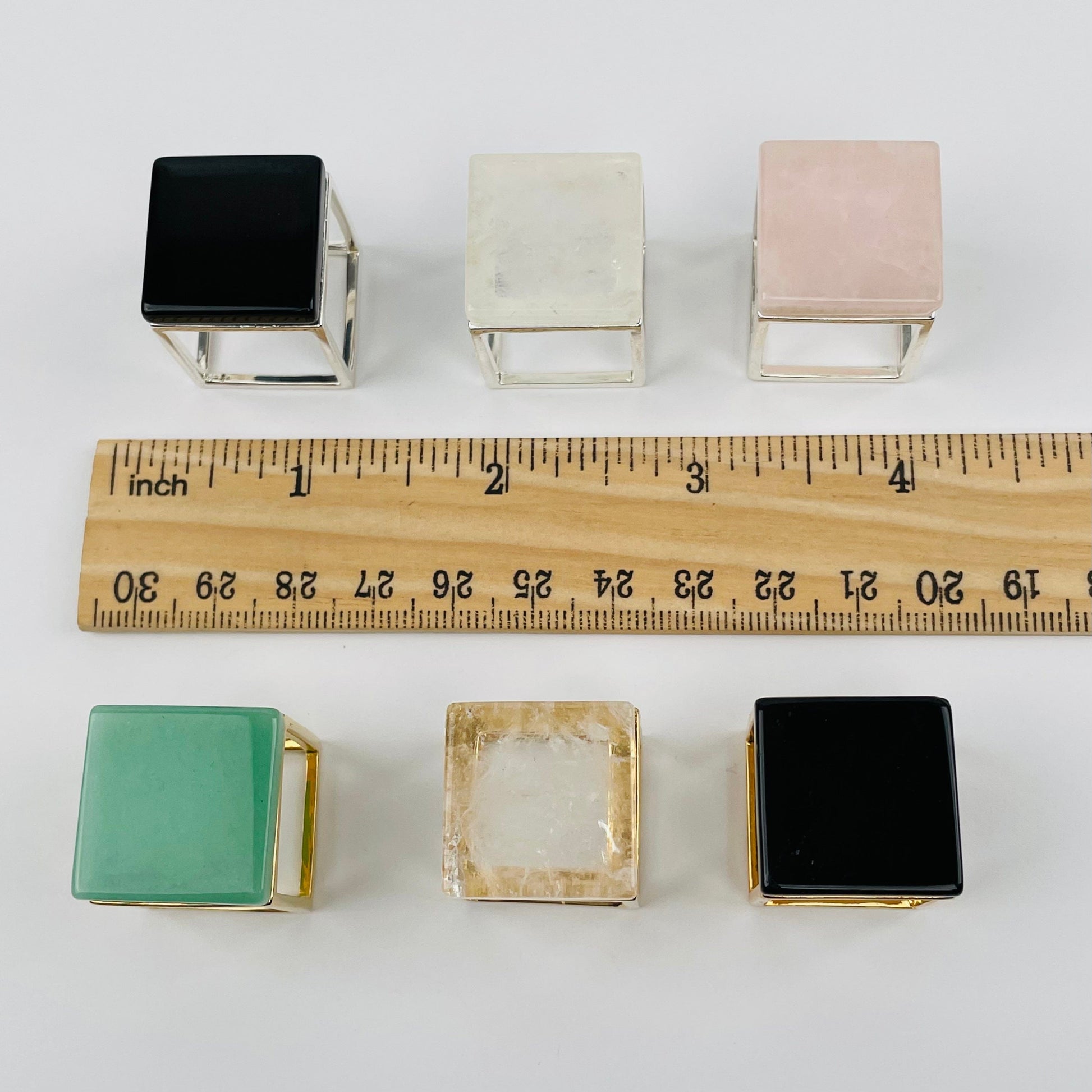 rings next to a ruler for size reference 
