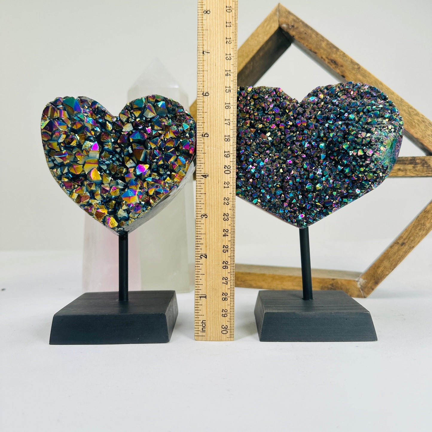 titanium coated heart on stand with decorations in the background