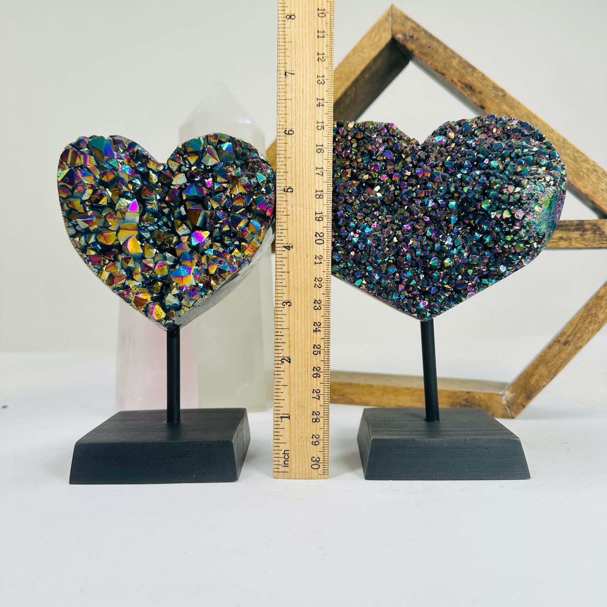 titanium coated heart on stand with decorations in the background