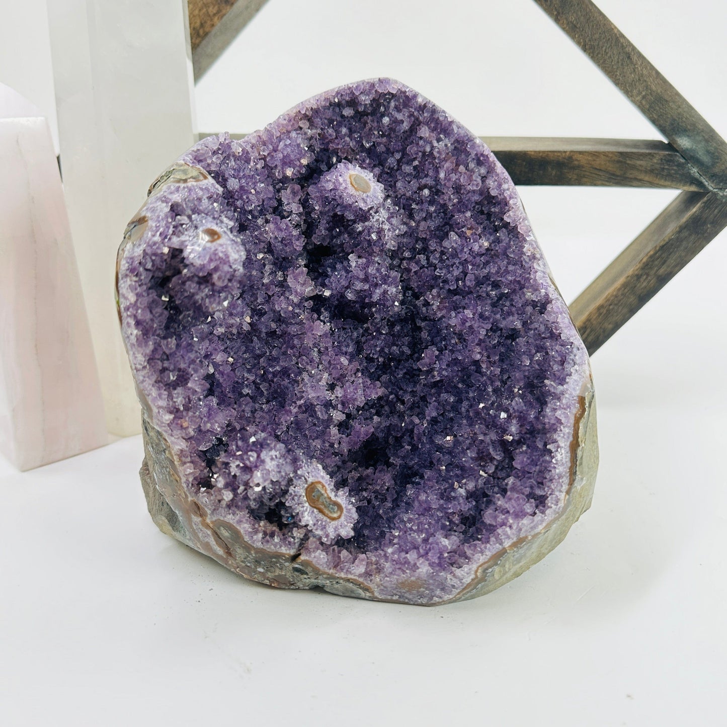 amethyst cut base with decorations in the background