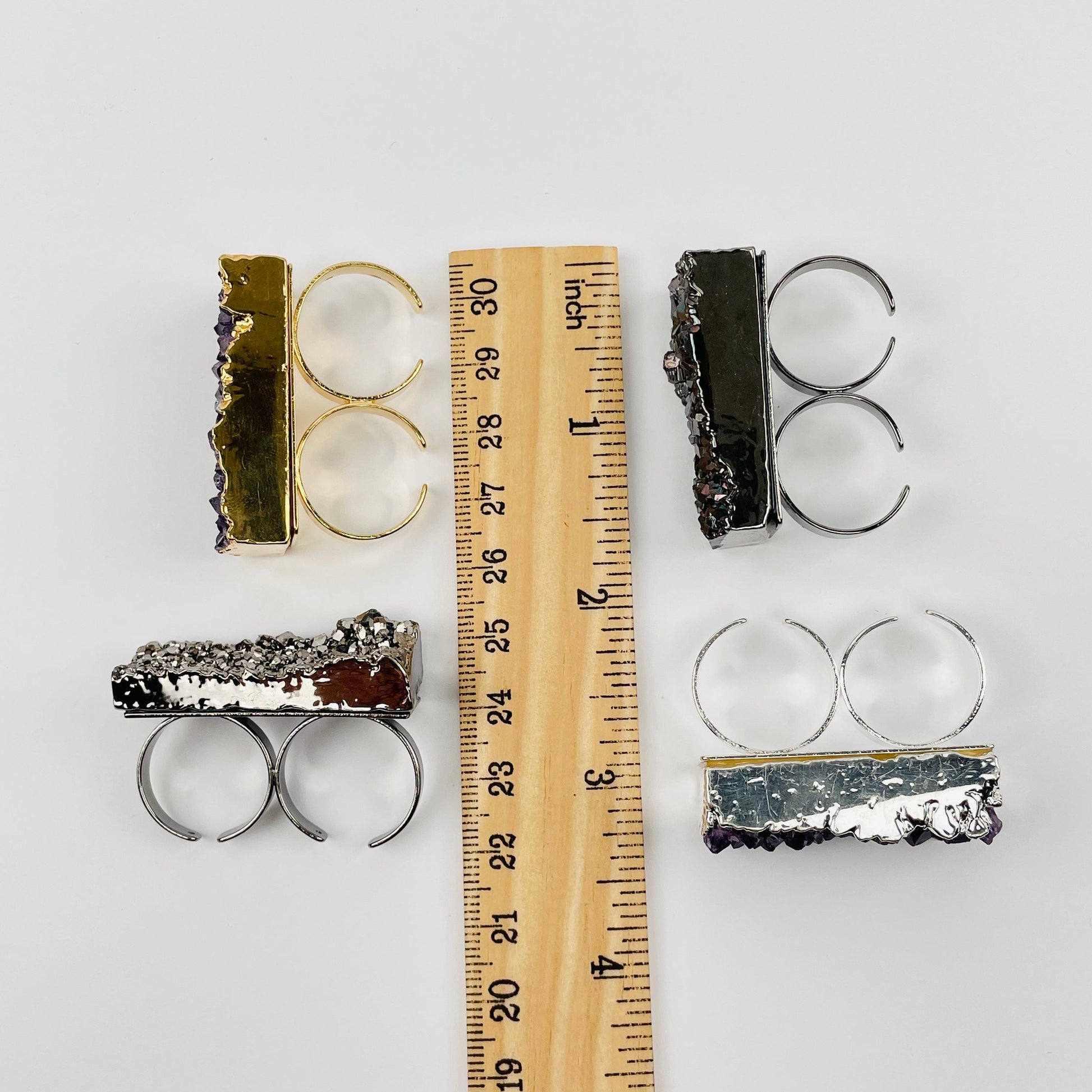 rings next to a ruler for size reference 