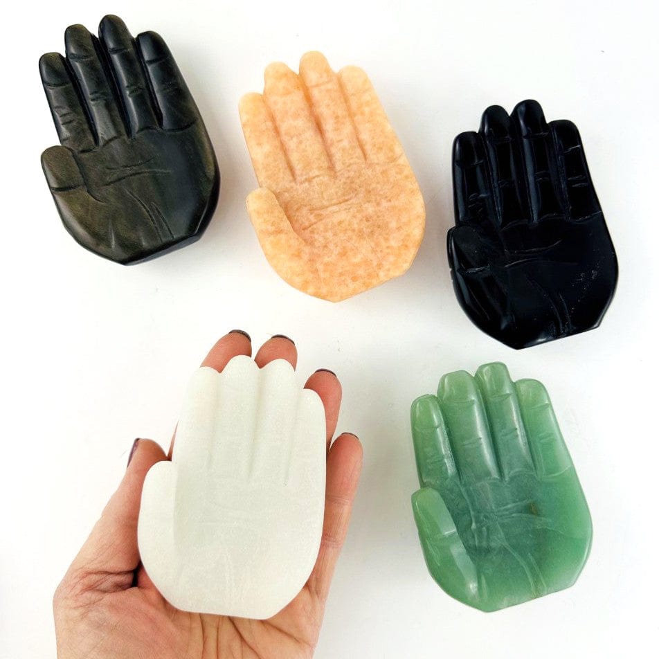 Hamsa Hand Stone Carvings in all the available stones, one in a hand for size reference