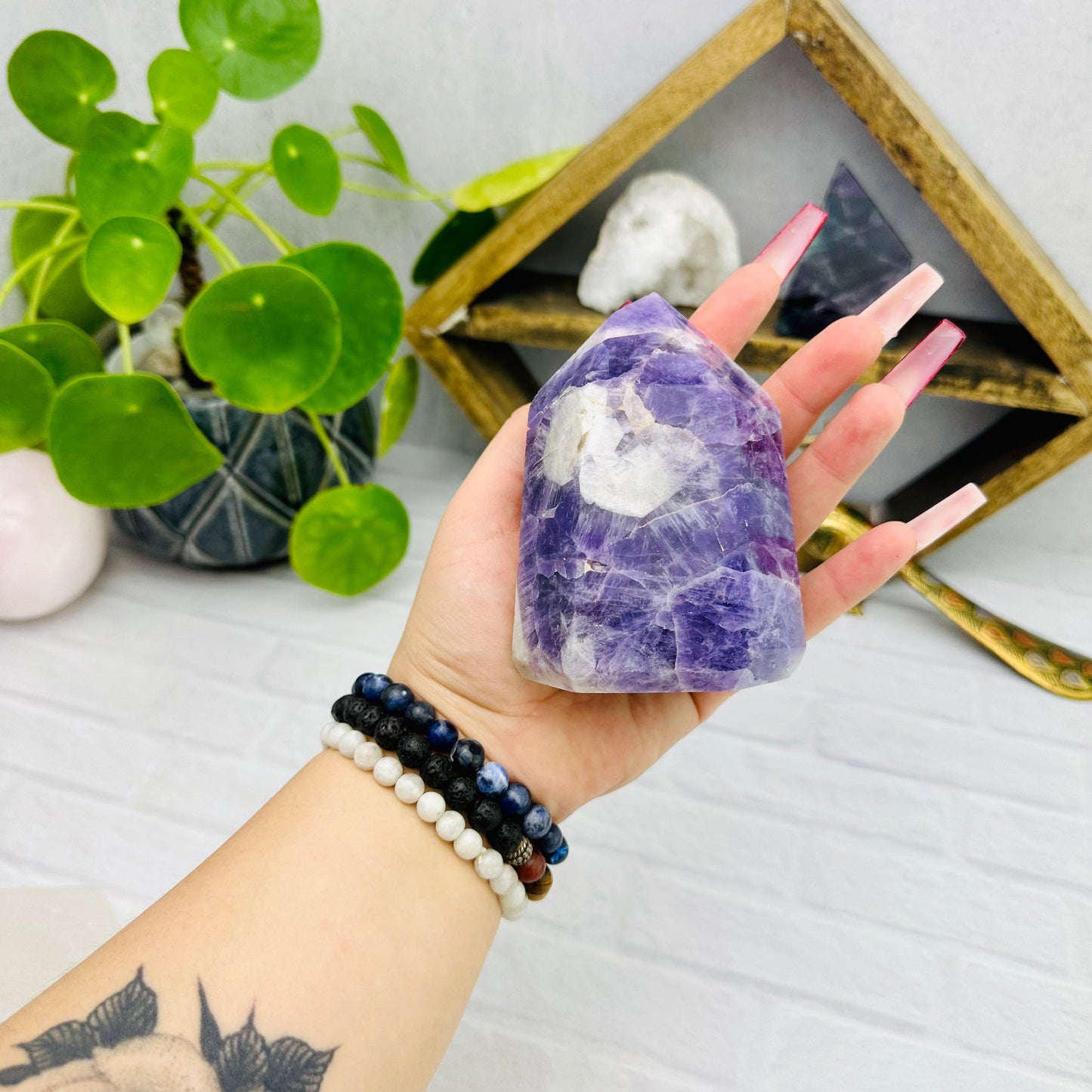  Amethyst Chevron Polished Point - in hand for size refence 