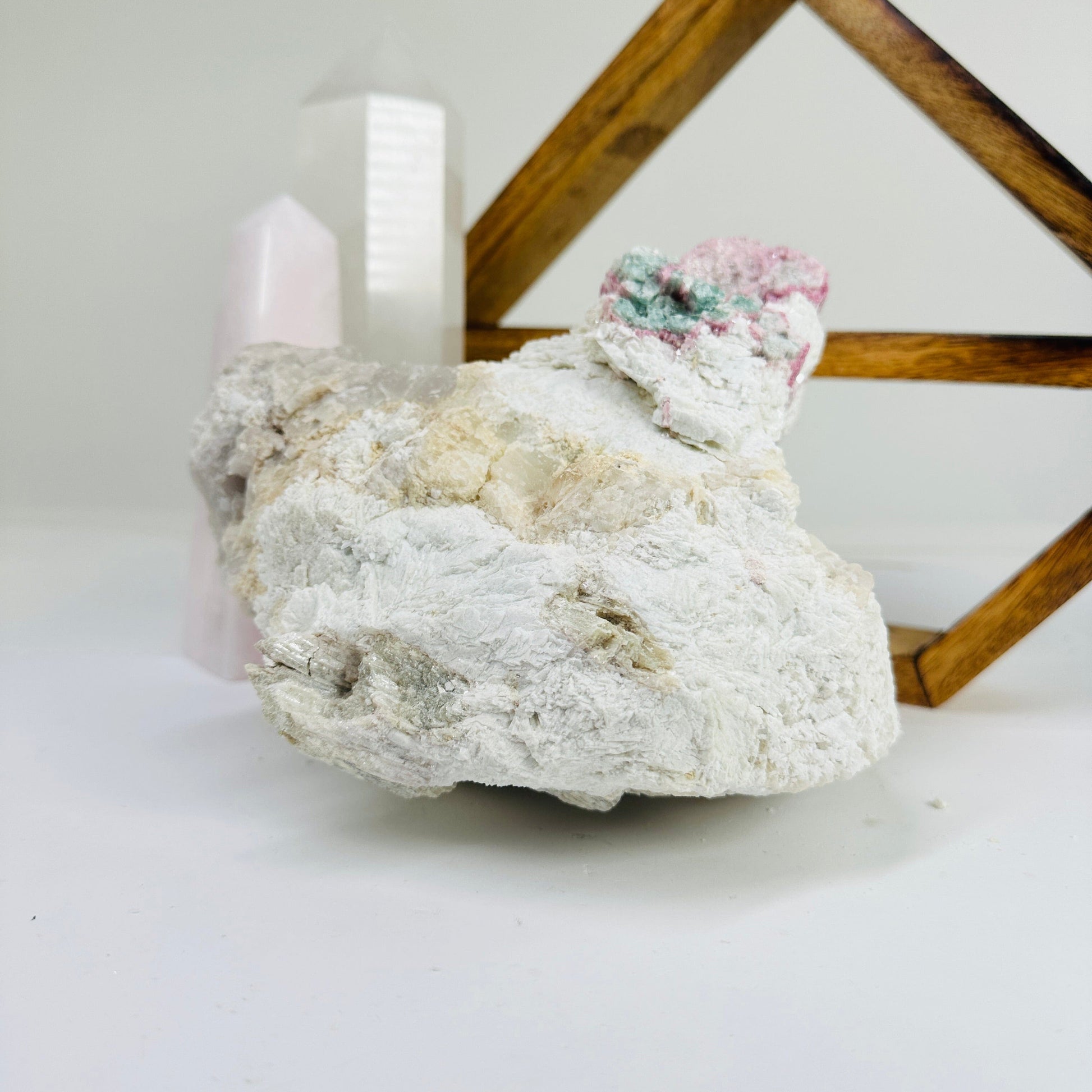 watermelon tourmaline with decorations in the background
