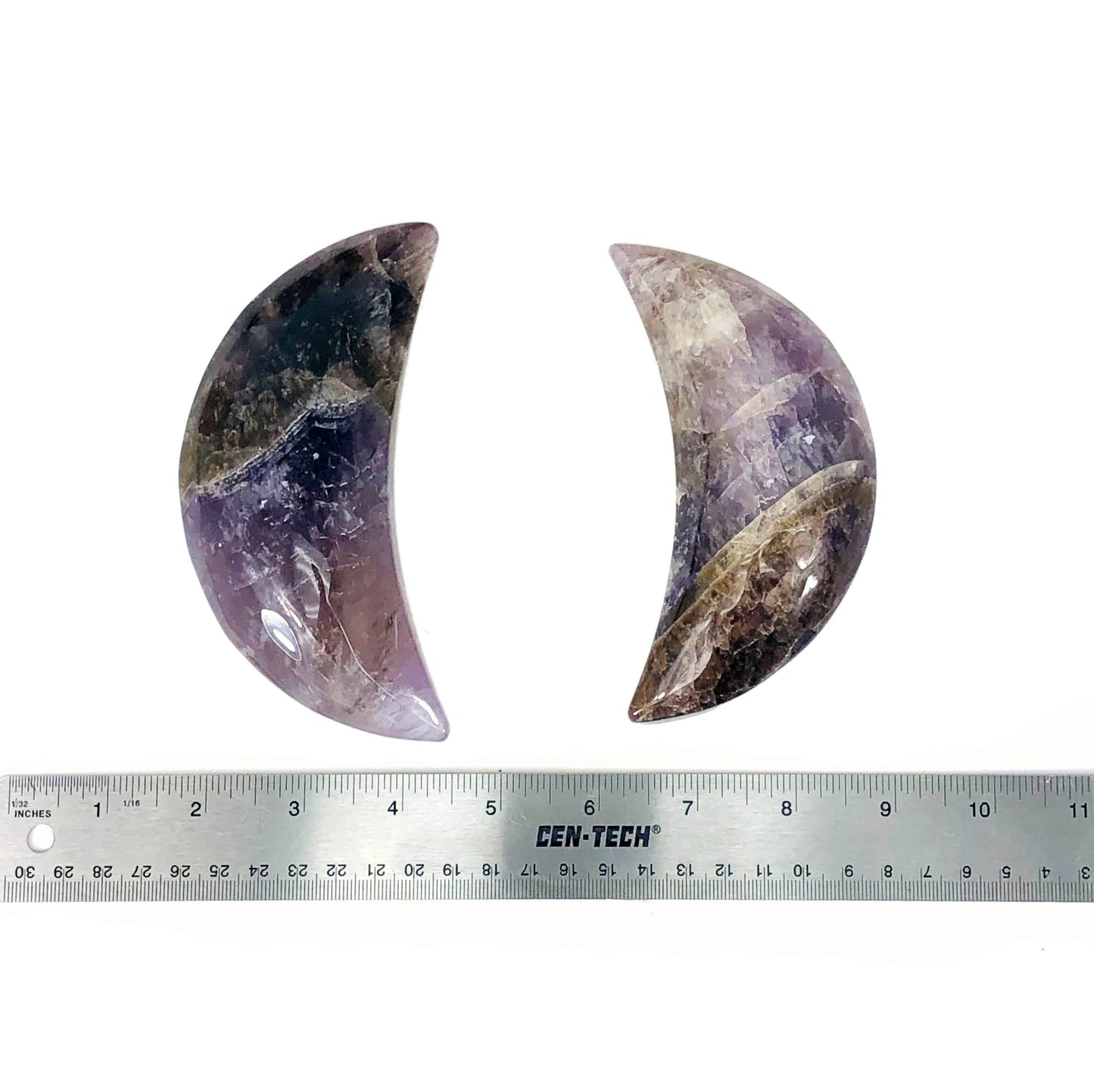 two seven minerals in one polished moons with ruler for size reference