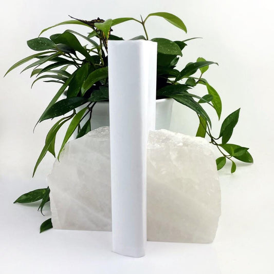 Crystal quartz bookend with a white book between them.