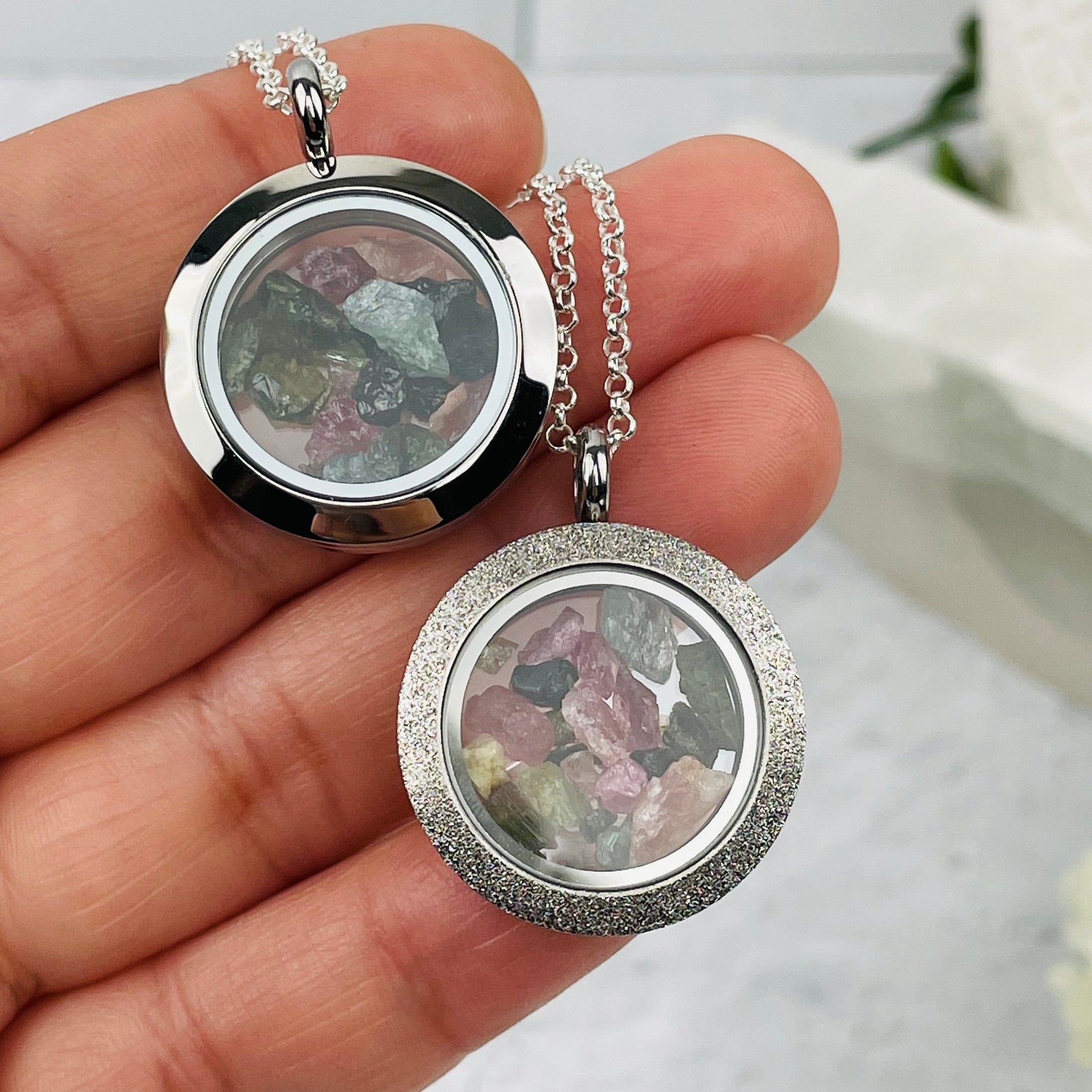 pendants in hand for size reference  