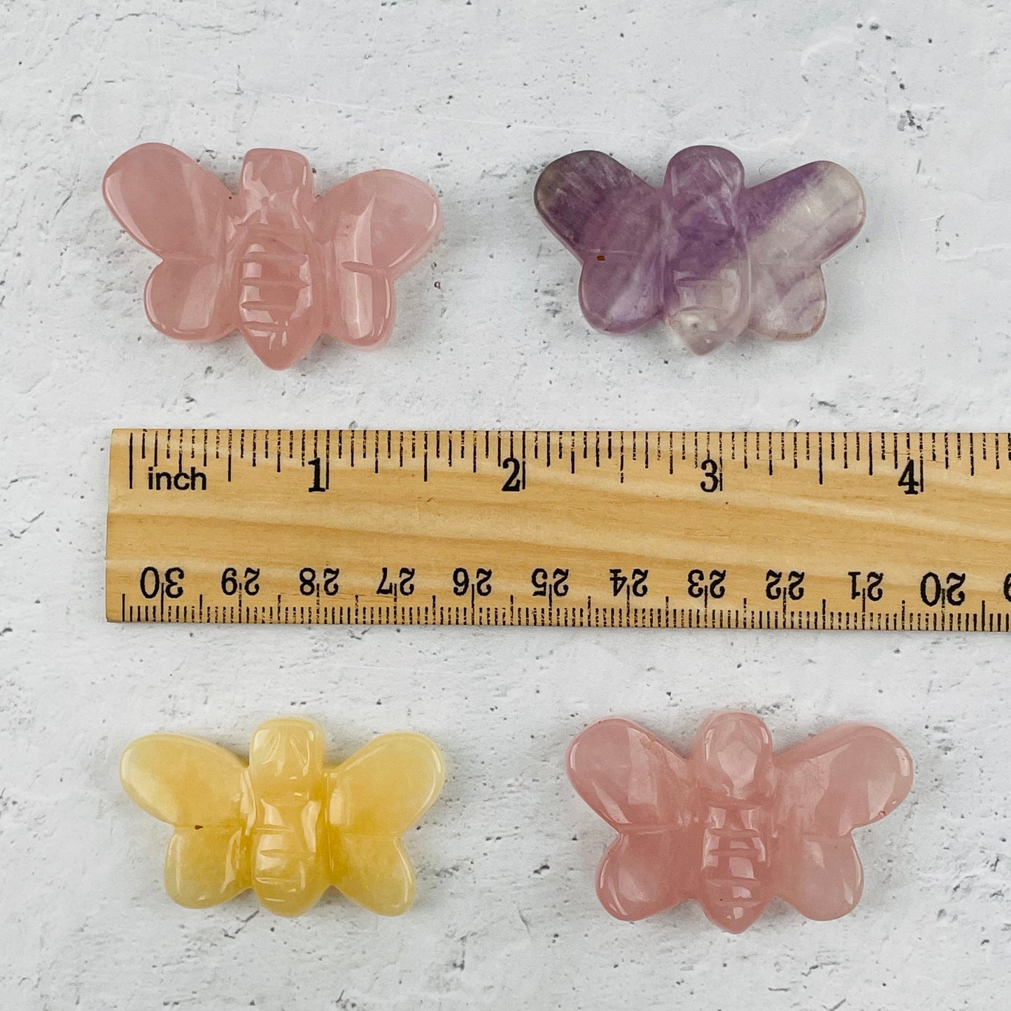 gemstone next to a ruler for size reference 