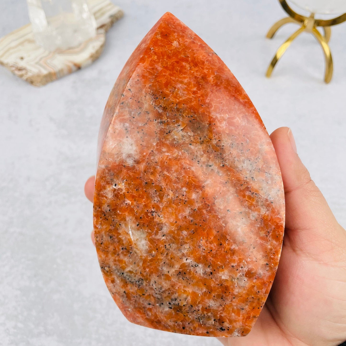 orchid calcite flame tower in hand for size reference 