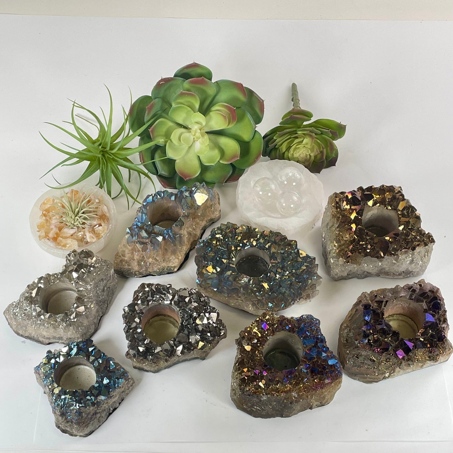 Titanium Coated Amethyst Crystal Candle Holder - You Choose all variants with props and plants in the background