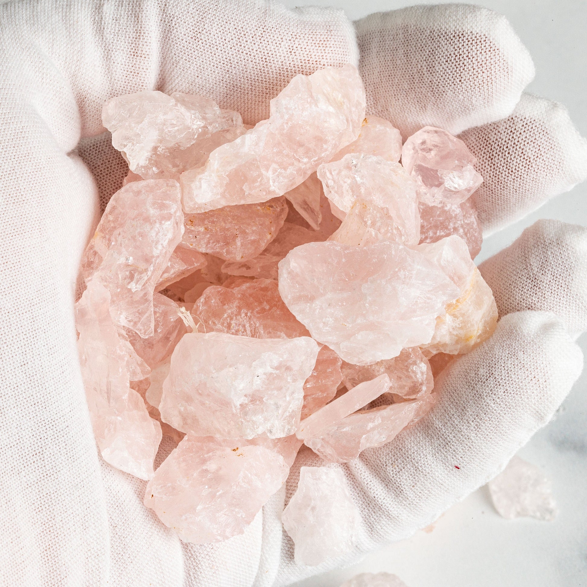 Rose Quartz Stones in a hand up close