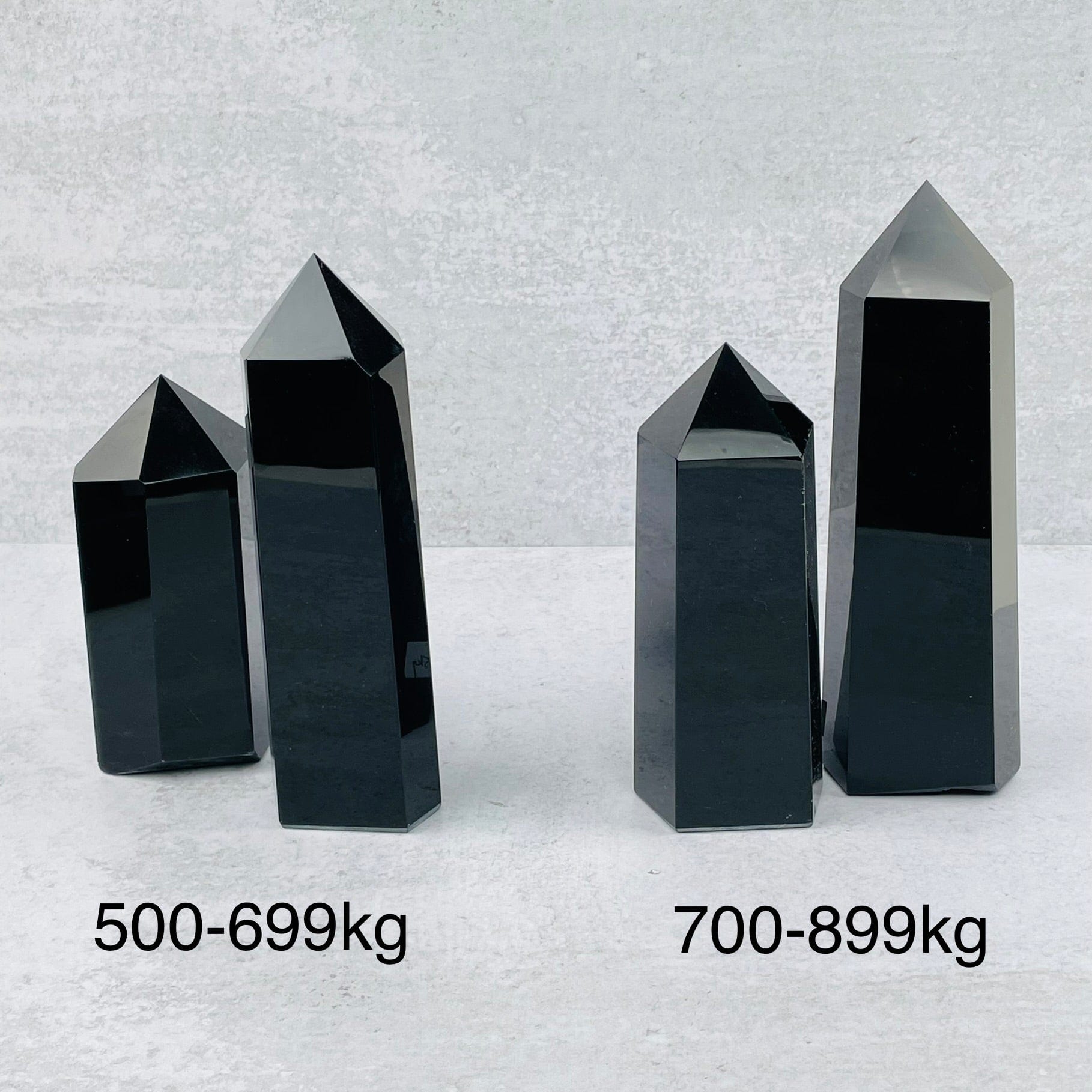 black obsidian towers next to their sizes 
