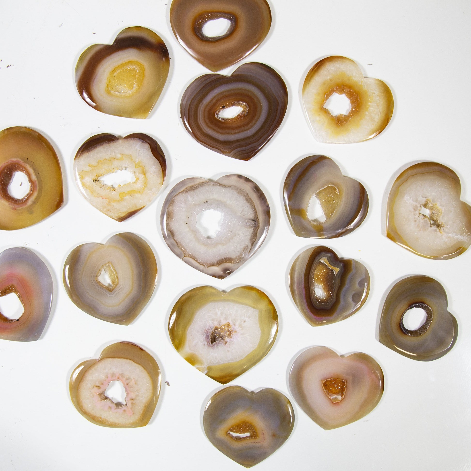 Natural Druzy Agates Heart Shaped - scattered on a table