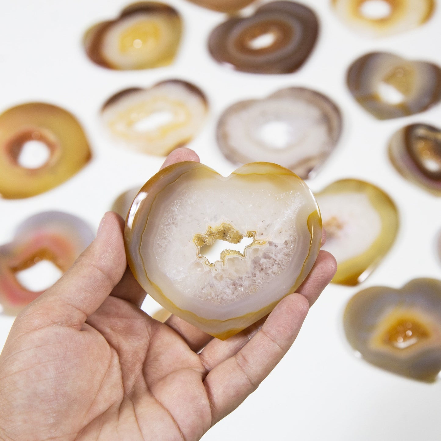 Natural Druzy Agates Heart Shaped - held in a hand