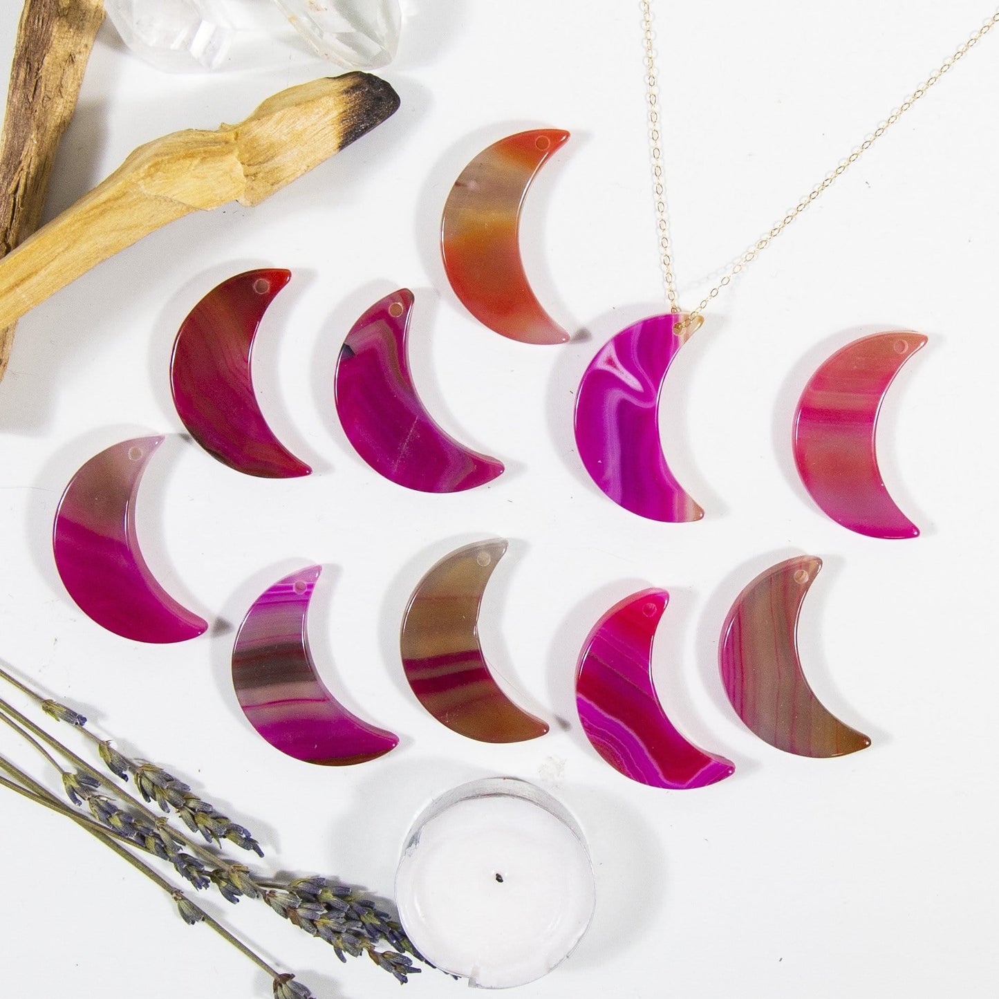 Multiple Pink Drilled Half Moon Agate With Necklace on White Background