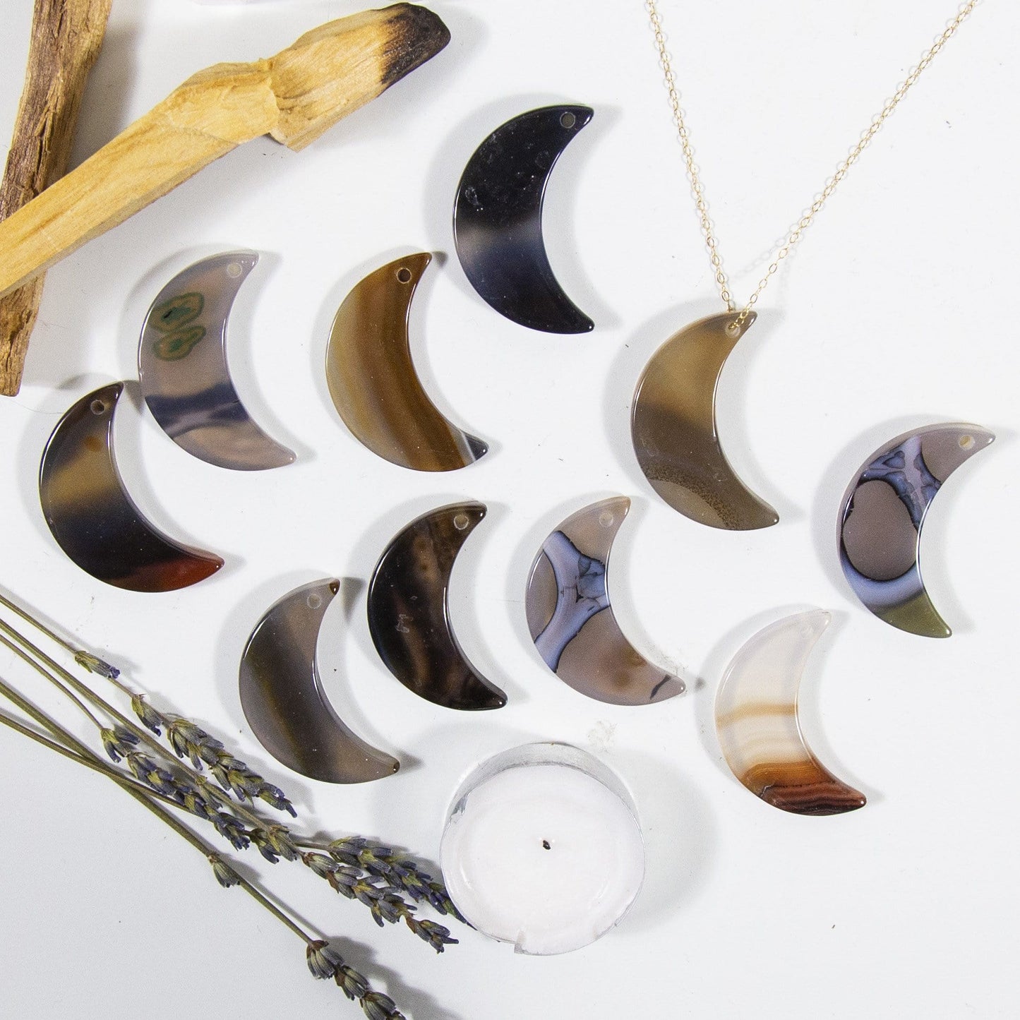 Multiple Natural Drilled Half Moon Agate With Necklace on White Background