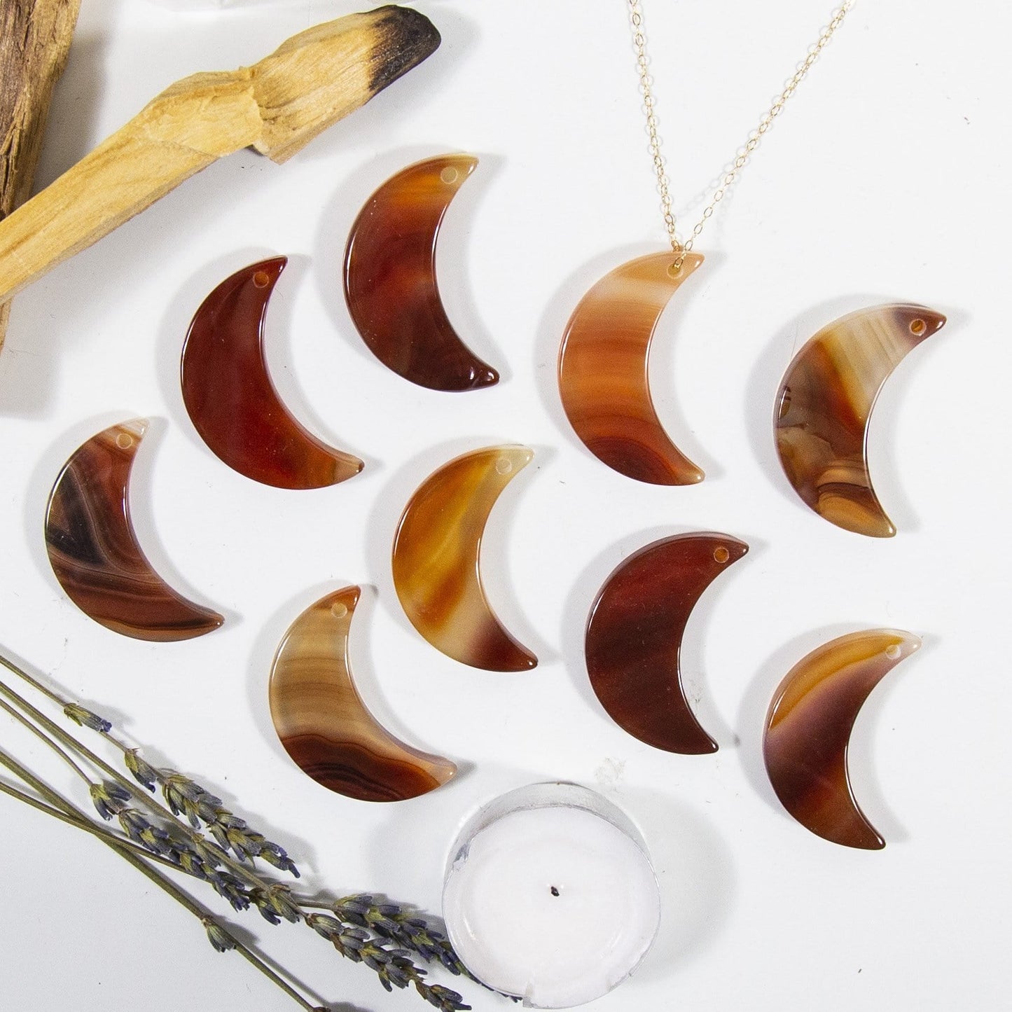 Multiple Red Drilled Half Moon Agate With Necklace on White Background