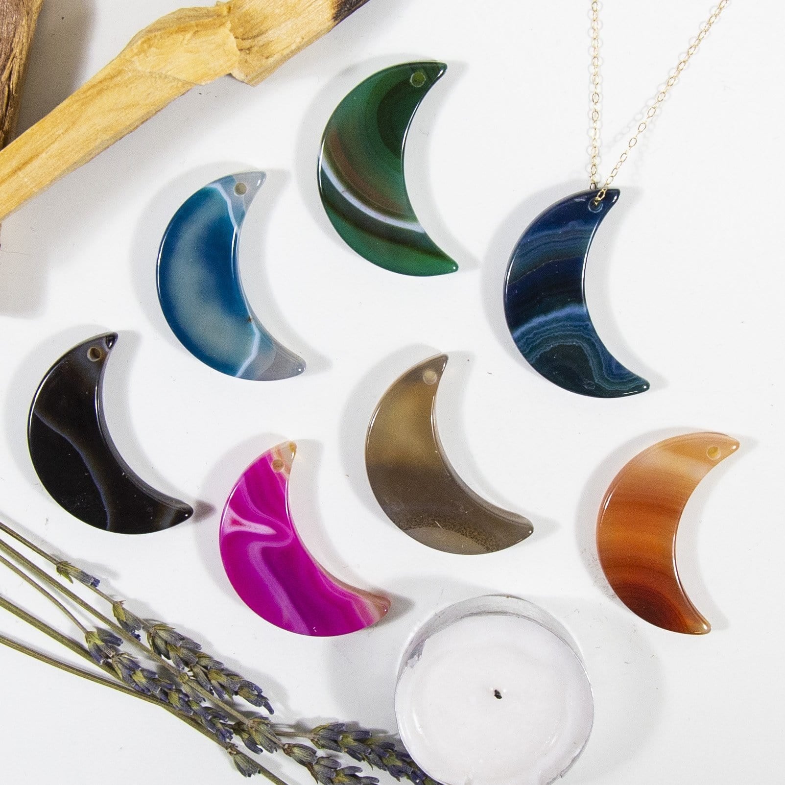 Assorted Color Drilled Half Moon Agate With Necklace  on White Background.