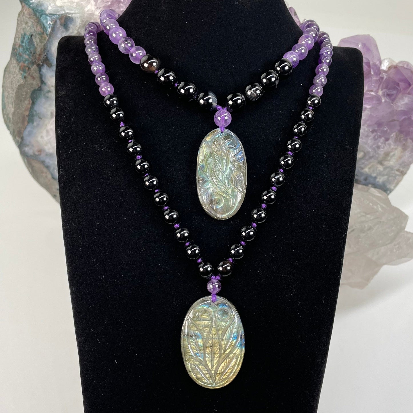 necklaces displayed to show the differences in the bead sizes 