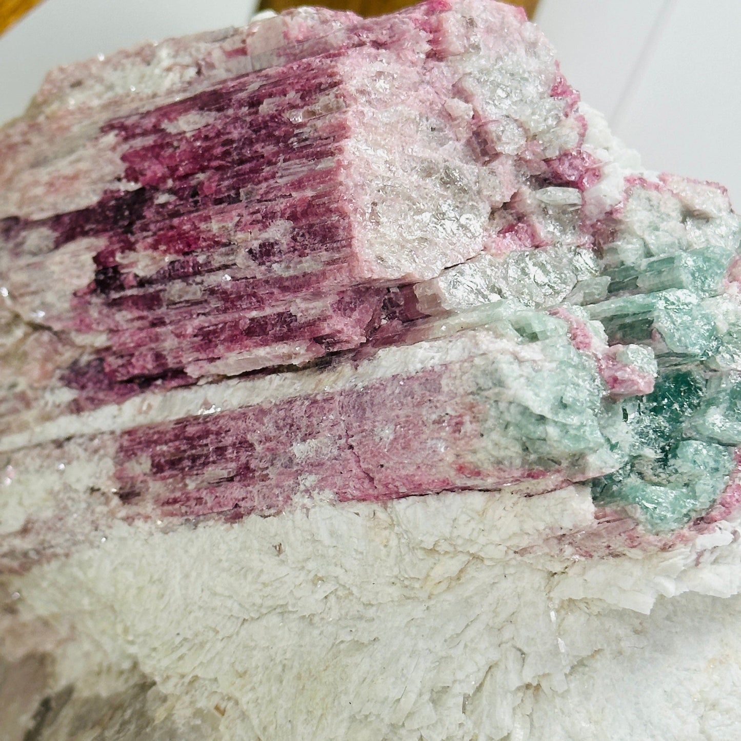 watermelon tourmaline with decorations in the background