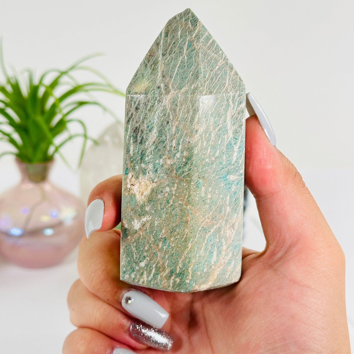 Amazonite Polished Crystal Point #1 in hand for size reference