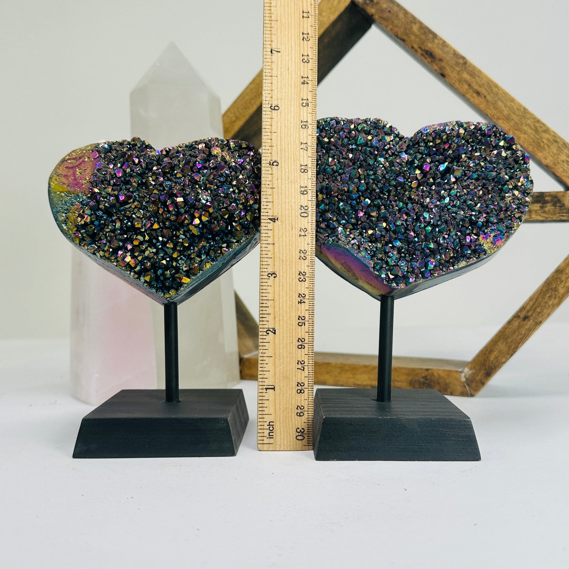titanium coated heart on stand with decorations in the background