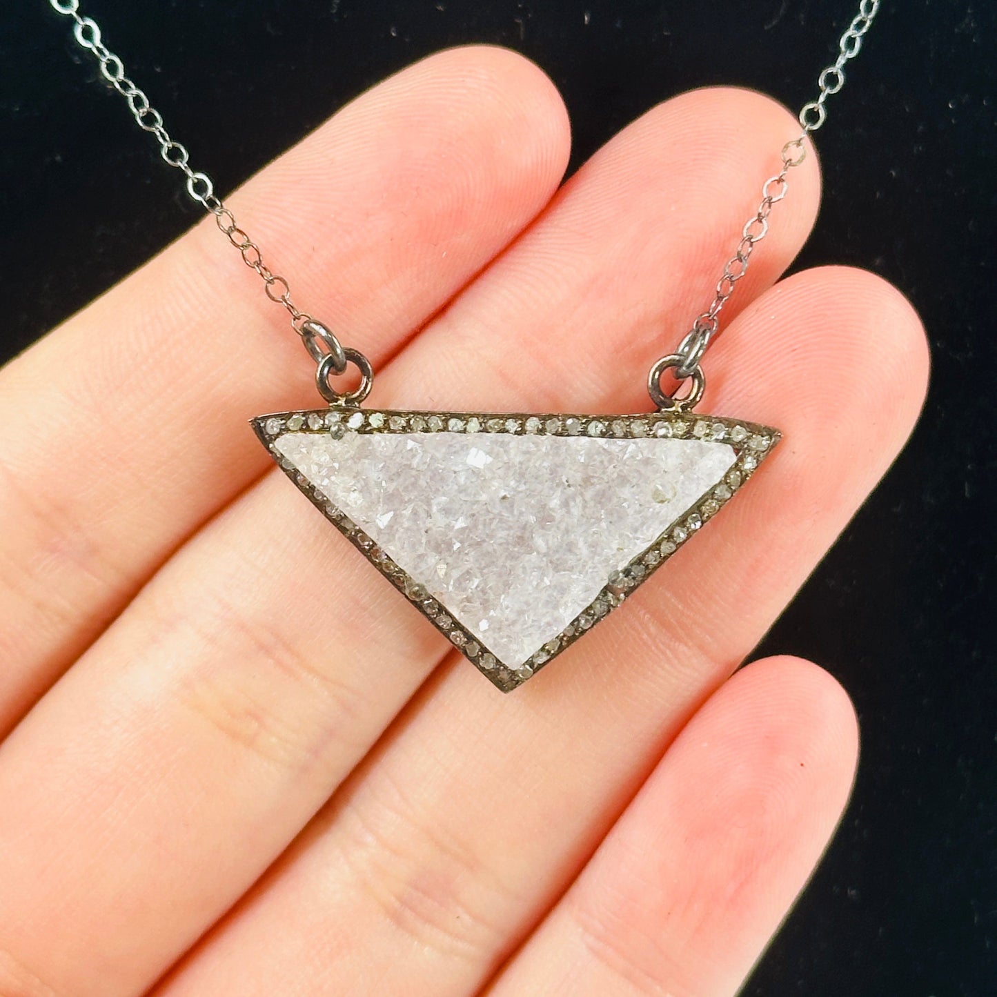 druzy pendant necklace on black background