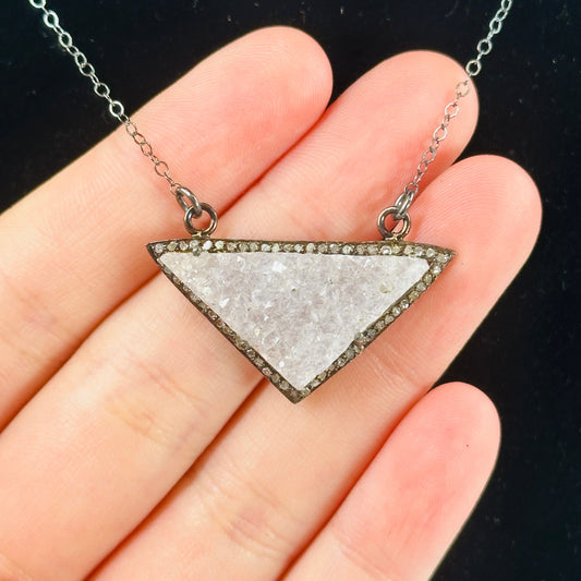 druzy pendant necklace on black background