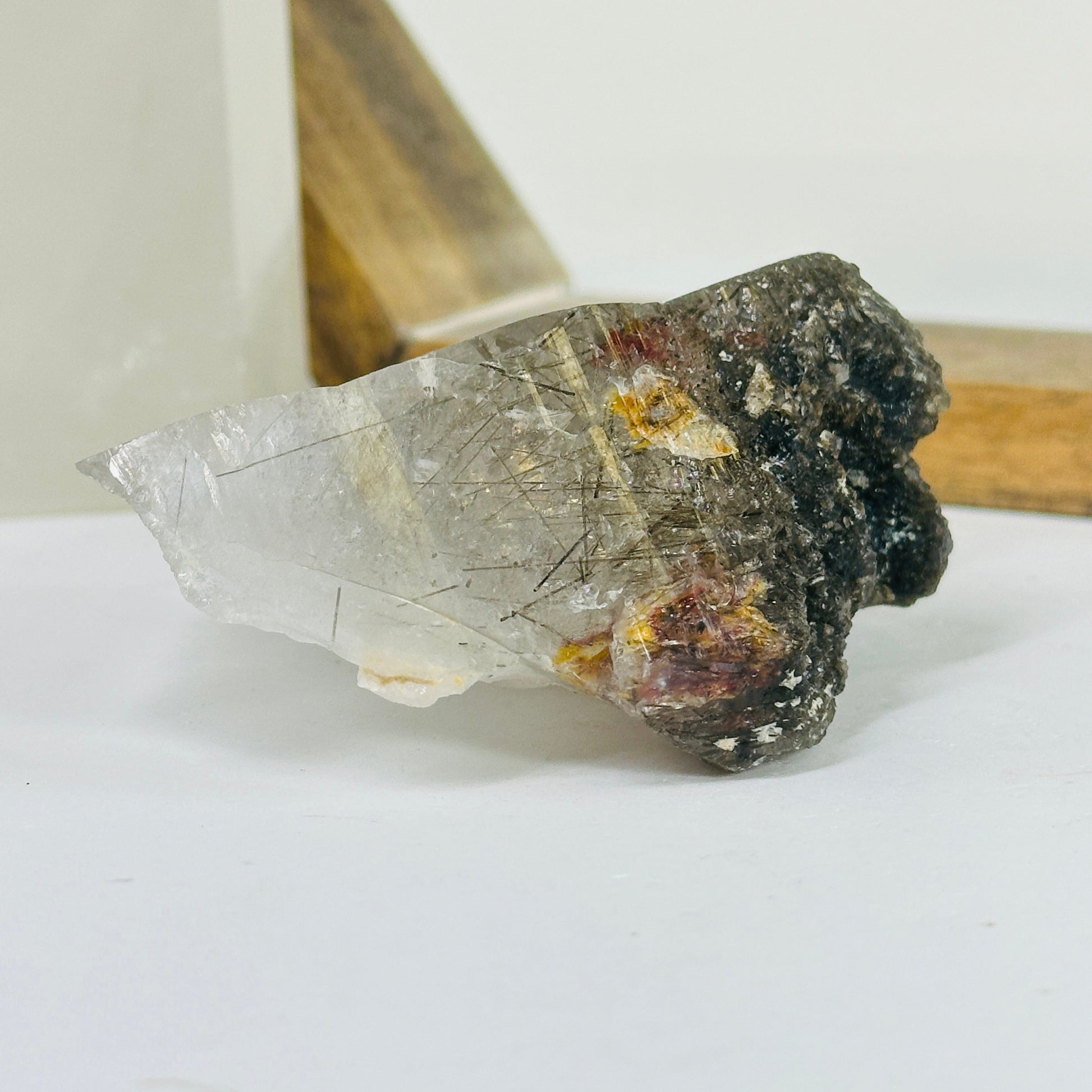 rutile quartz with decorations in the background