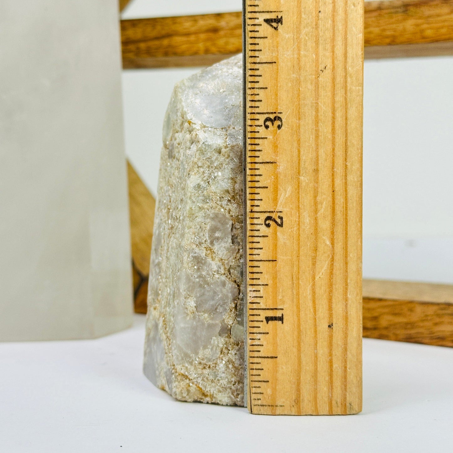 tourmaline point next to a ruler for size reference