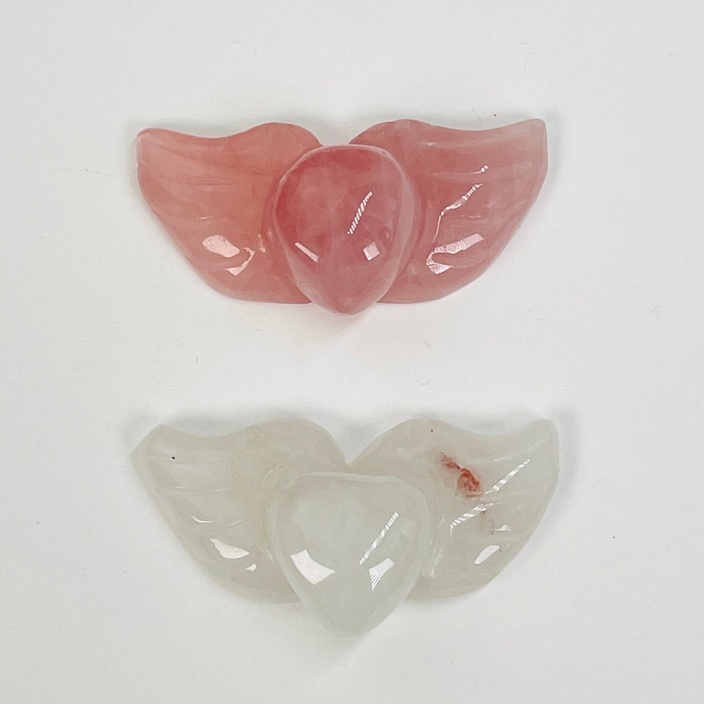 close up of the engraved details on the heart with wings gemstone 