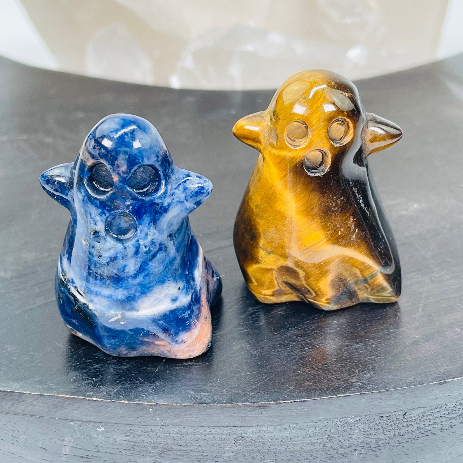 close up of the details on the sodalite and tigers eye carved ghost 