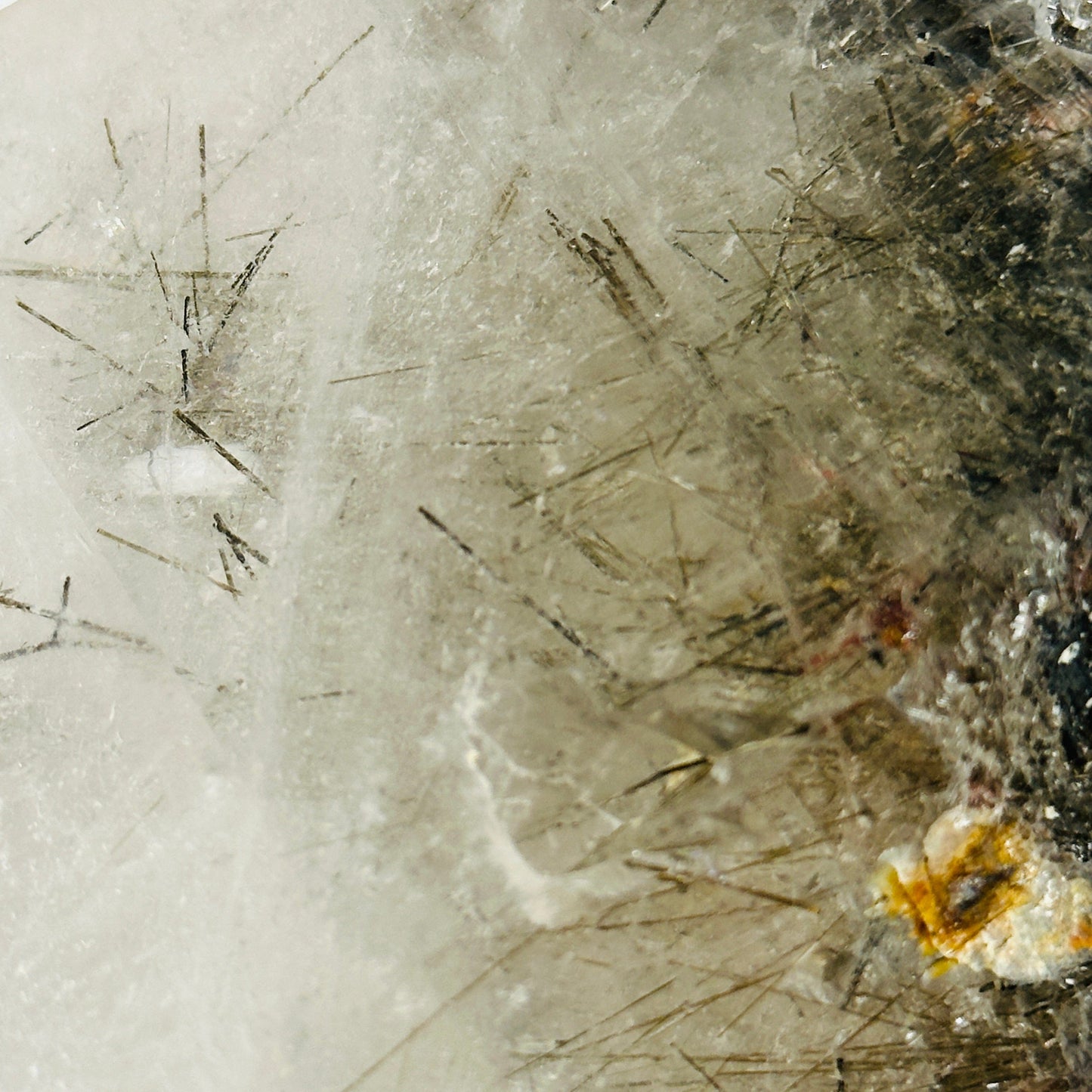 rutile quartz with decorations in the background