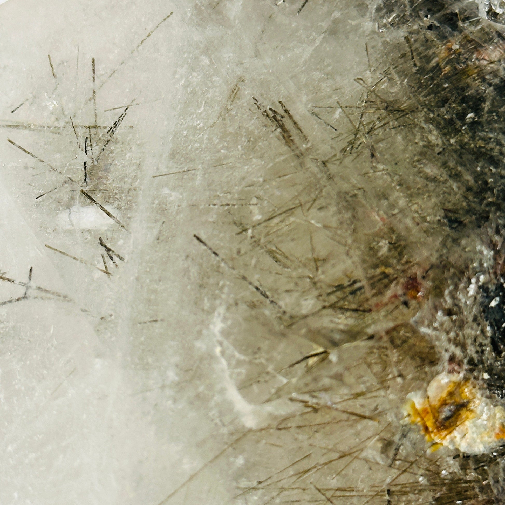 rutile quartz with decorations in the background