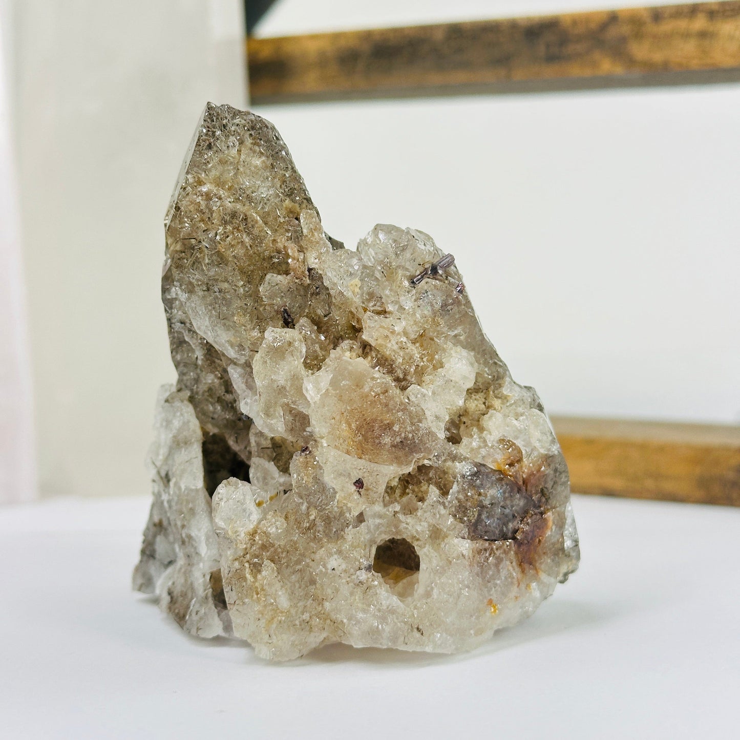 smokey quartz with decorations in the background
