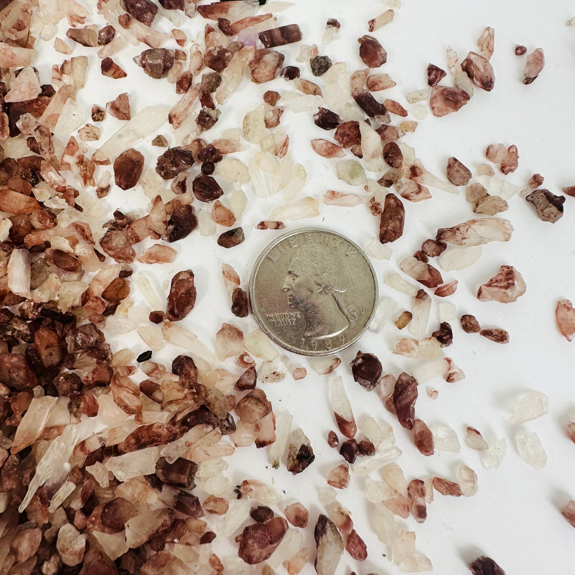 Lithium Quartz Crumble - 1 Lb Bag - next to quarter for size reference 