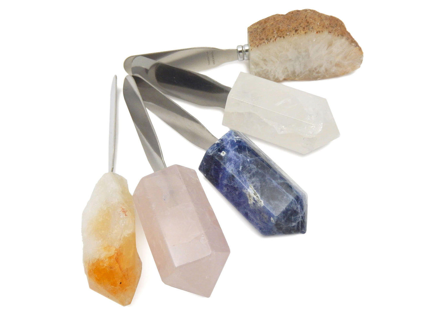 5 different Stone Butter Spreaders displayed on white surface