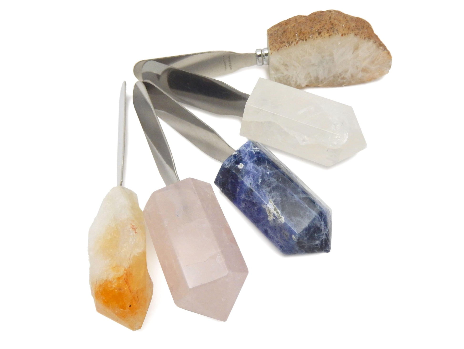 5 different Stone Butter Spreaders displayed on white surface