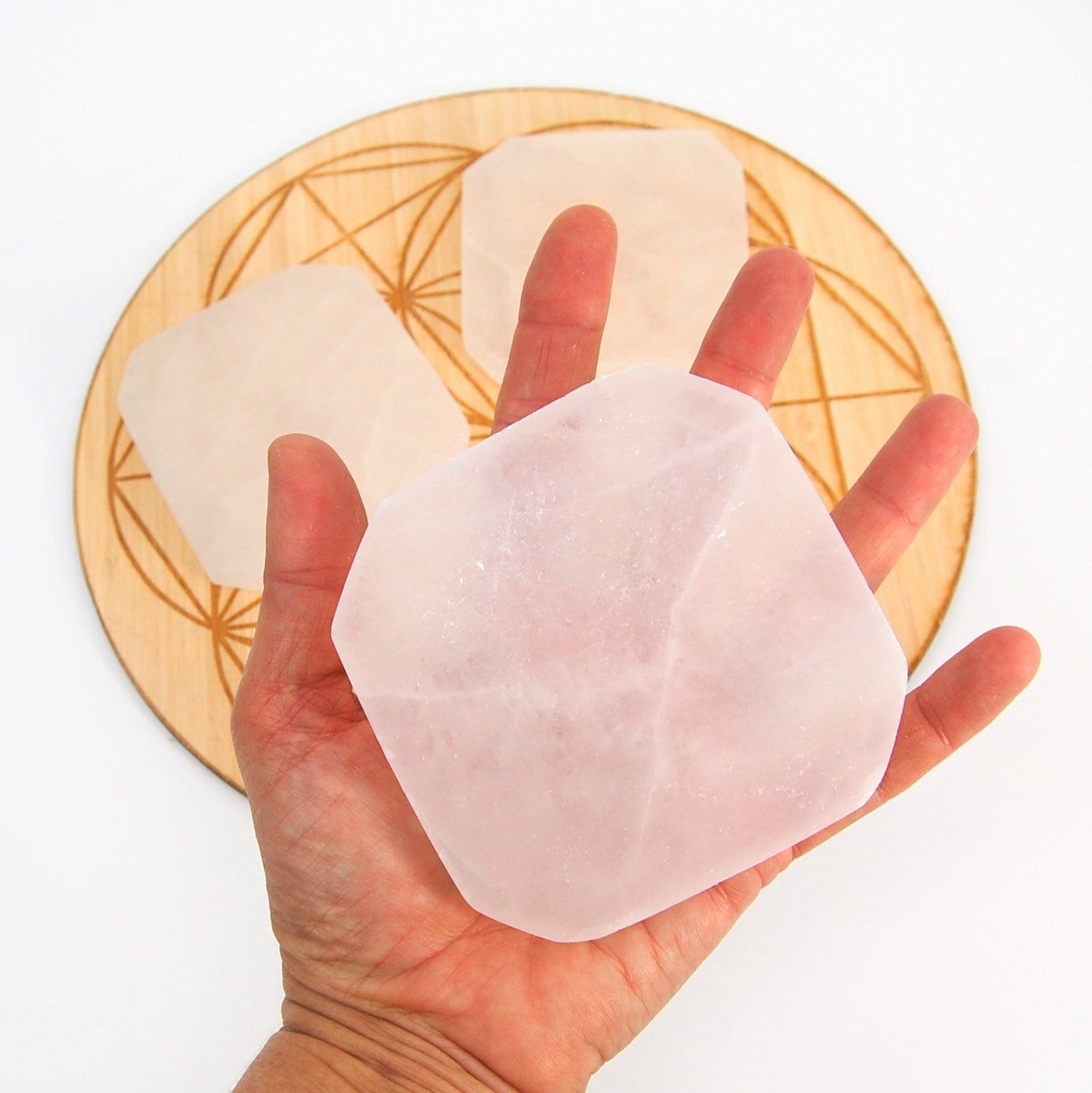selenite charging plate in hand for size reference