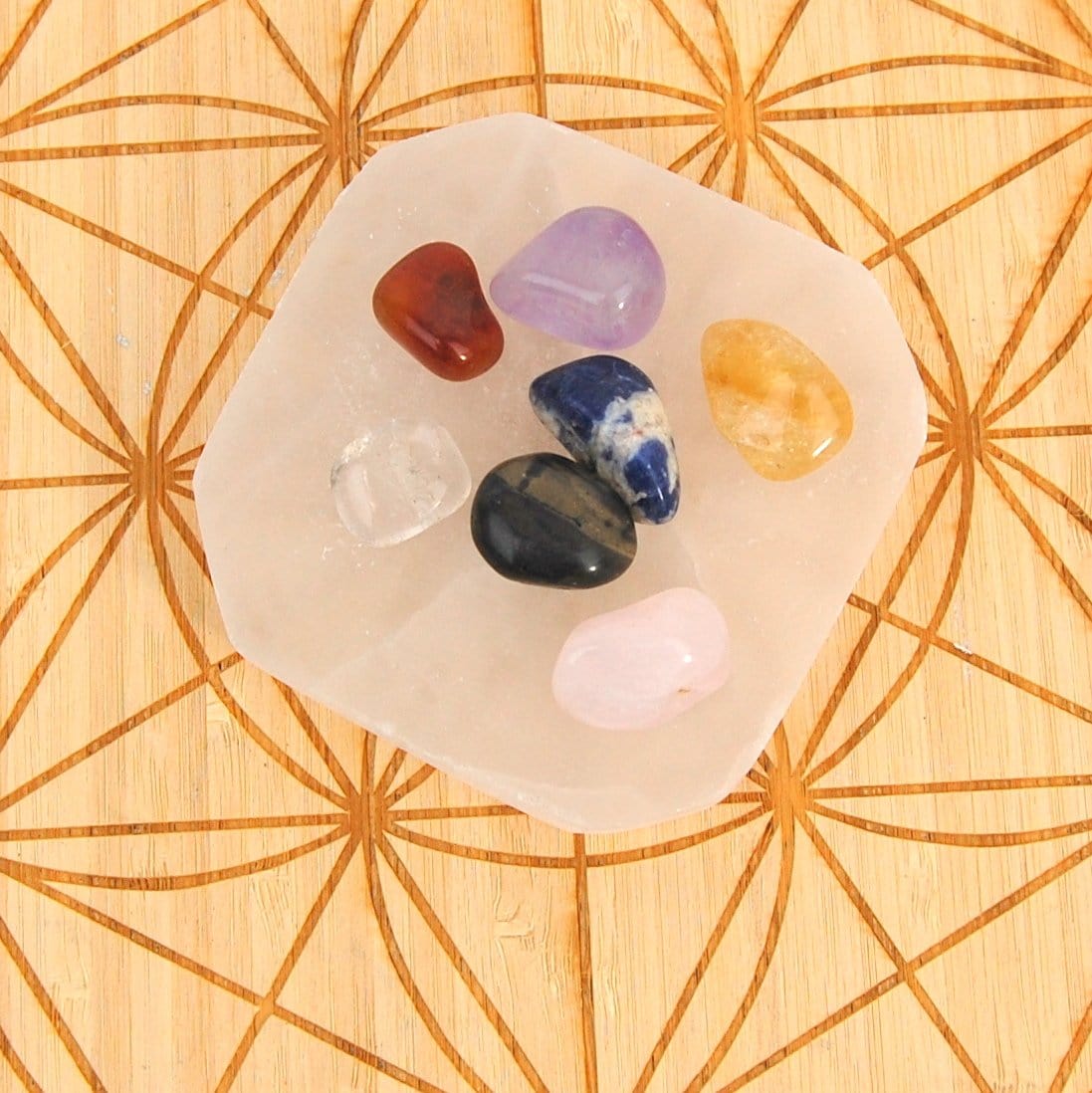 close up of selenite charging plate with stones for details and size reference