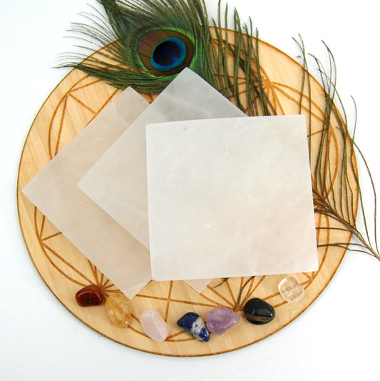overhead view of square selenite charging plates on display