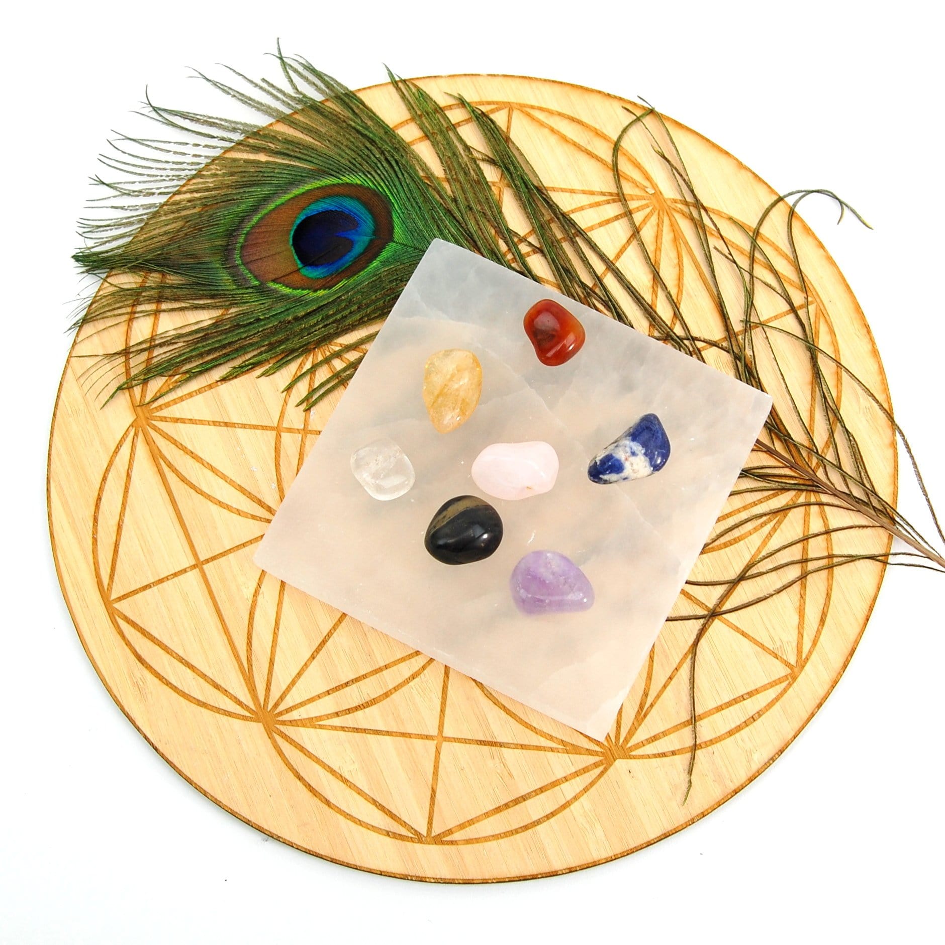 overhead view of square selenite charging plate with stones 