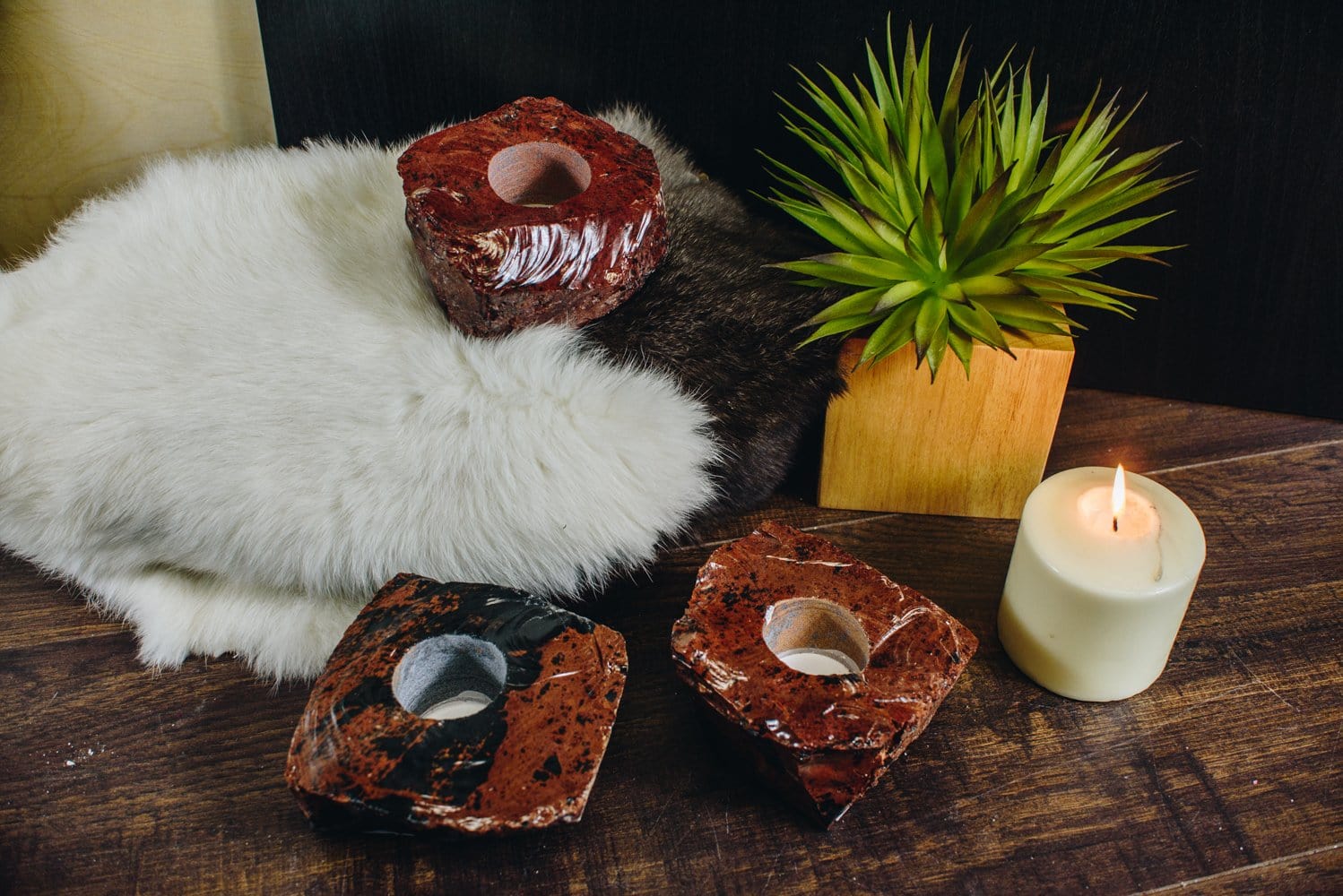 3 coffee obsidian candle holders on a wood background