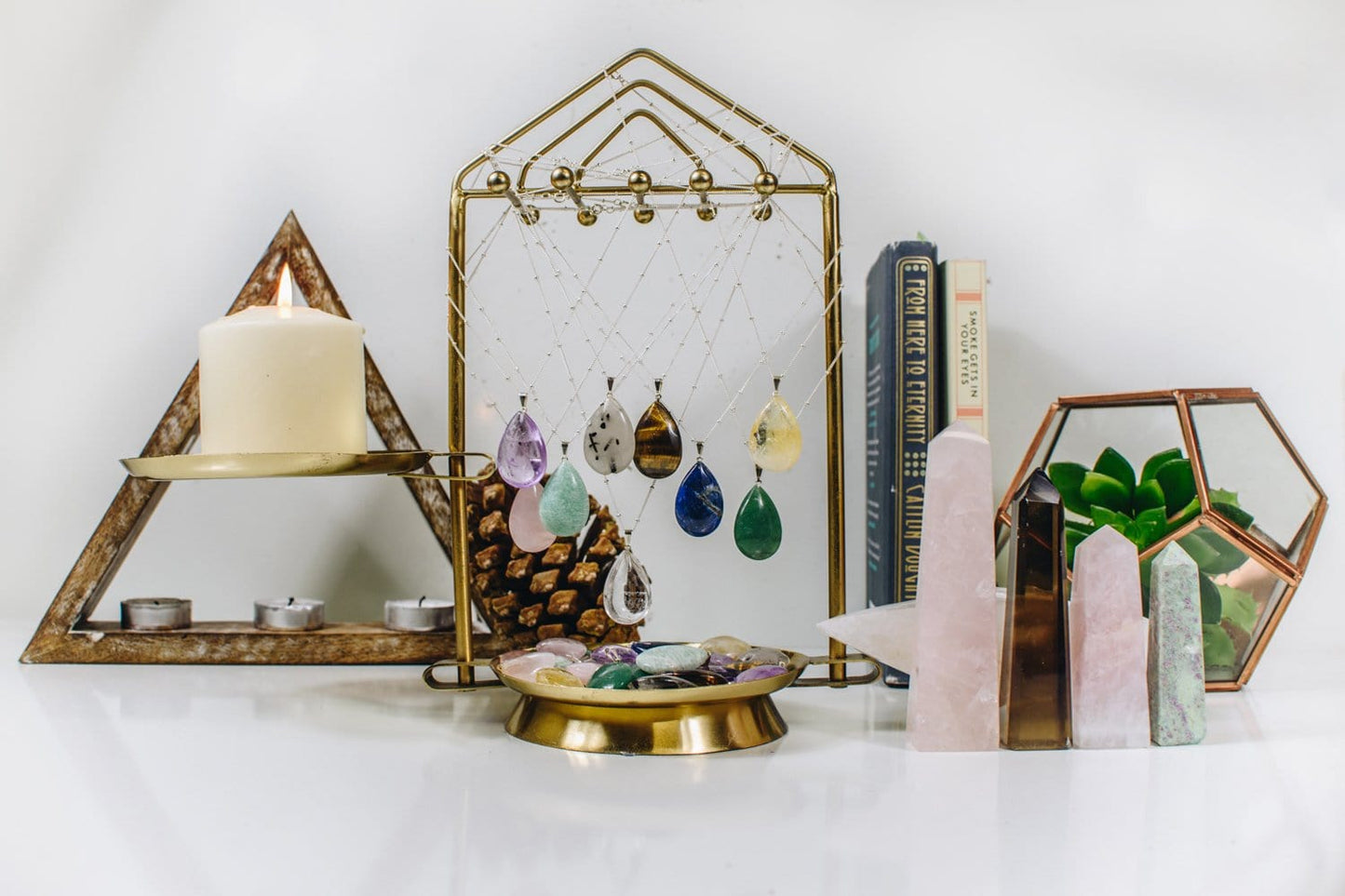 Gemstone Teardrop Pendants  of different stones, hanging from a holder