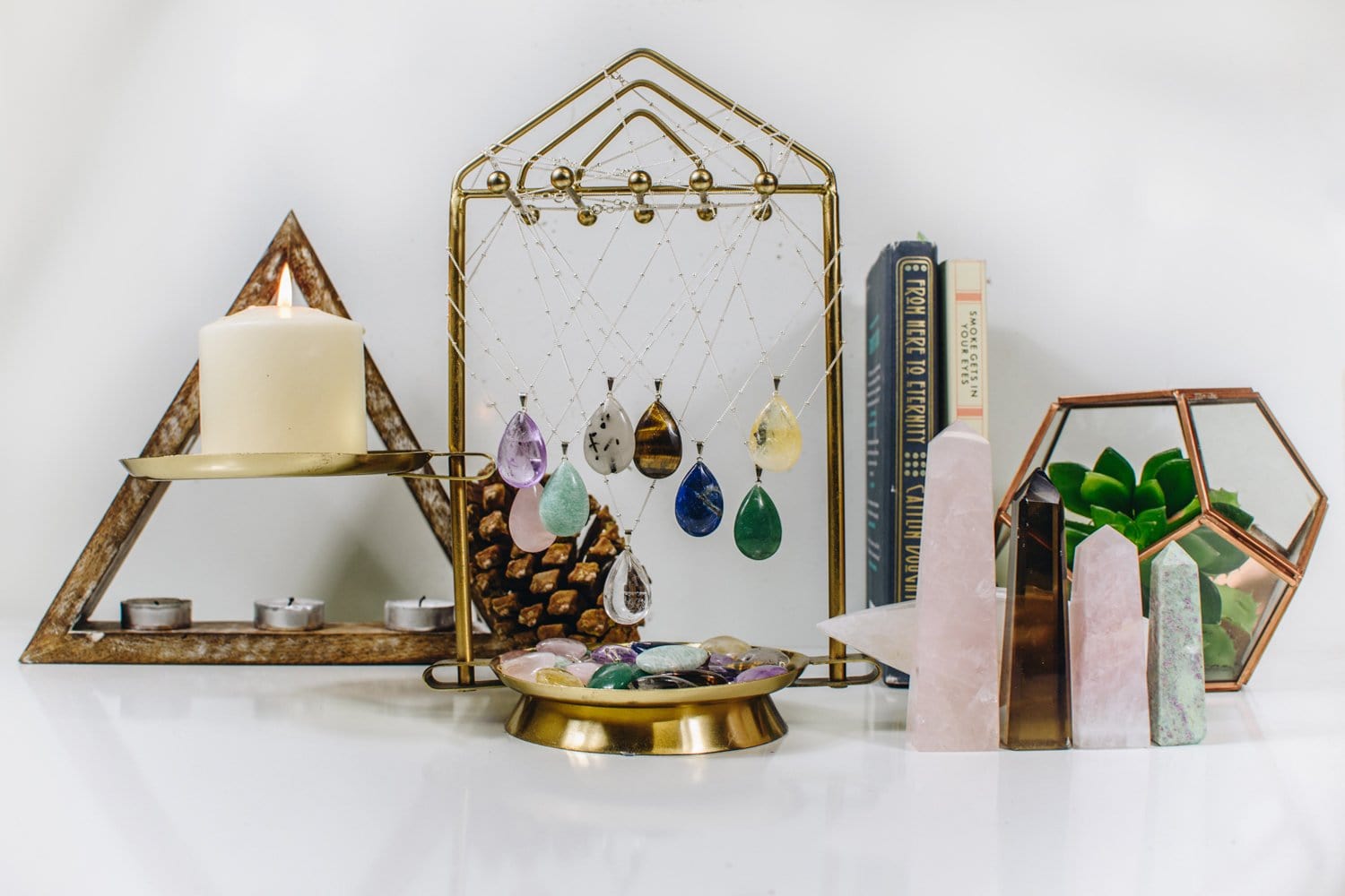 Gemstone Teardrop Pendants  of different stones, hanging from a holder