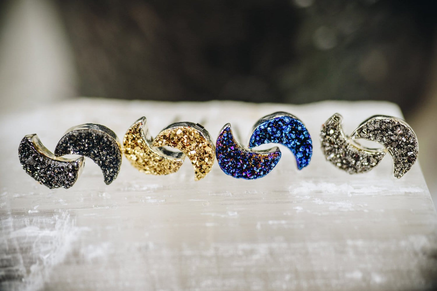 moon druzy earrings in a row