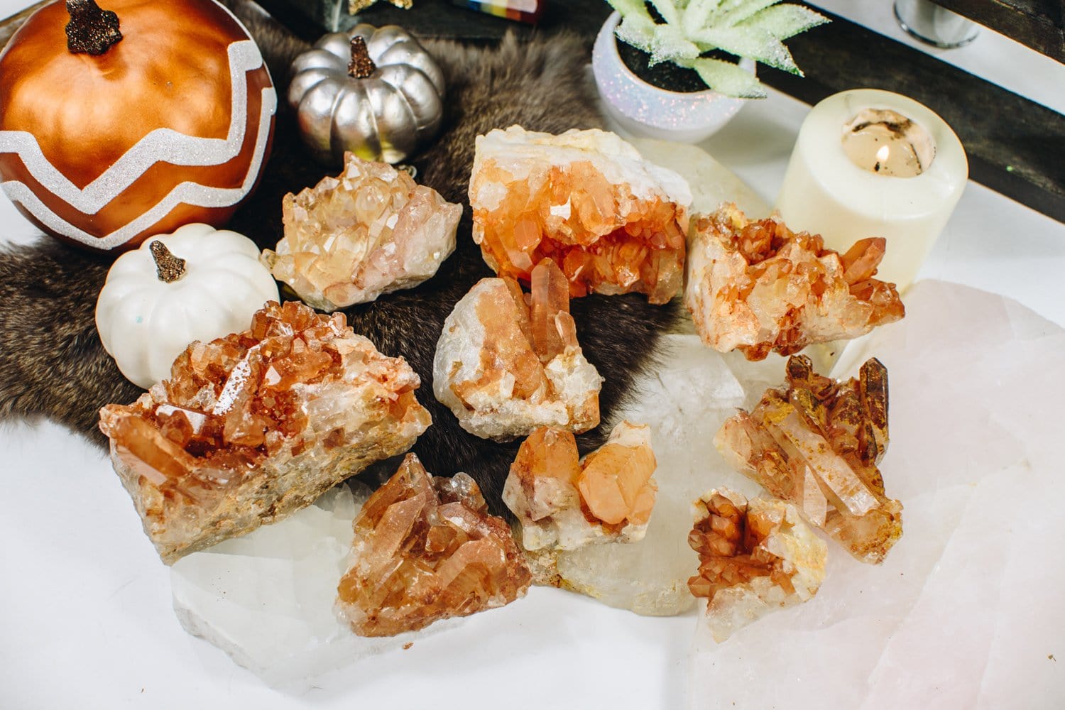 9 pieces of Tangerine Quartz Clusters surrounded by home décor