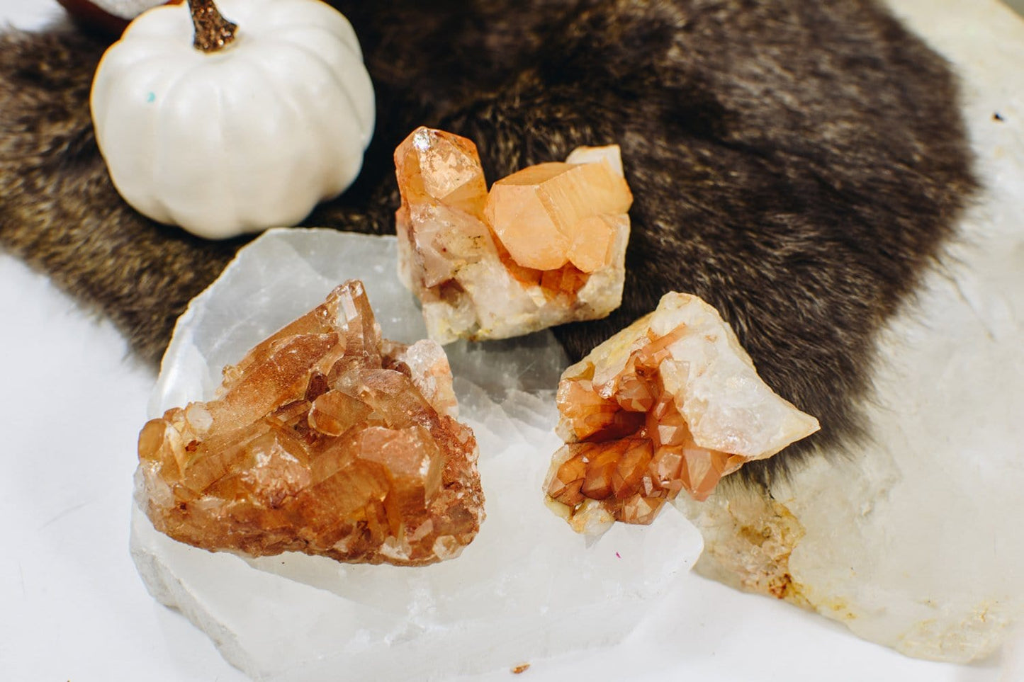 3 Tangerine Quartz Clusters  on a selenite plate and fur décor 